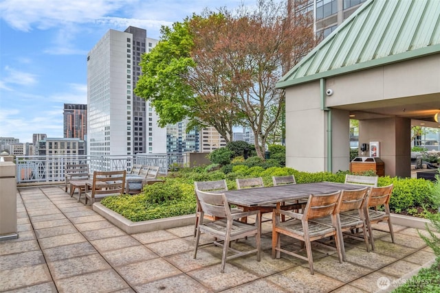 819 Virginia St Unit 3006, Seattle, WA 98101 - view of patio / terrace featuring a view of city and outdoor dining space