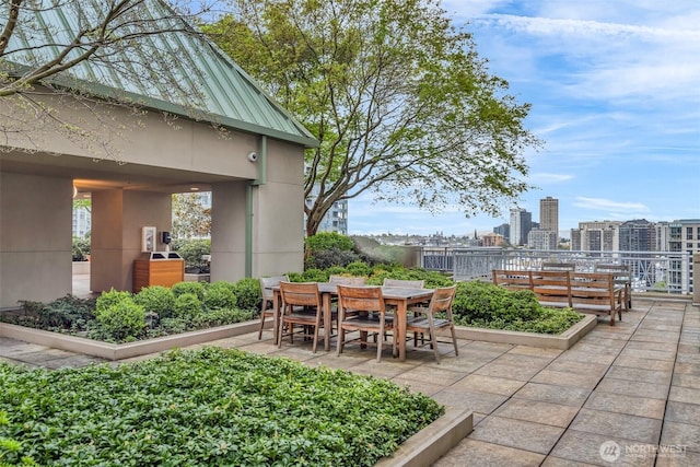 819 Virginia St Unit 3006, Seattle, WA 98101 - view of patio / terrace featuring a view of city and outdoor dining space