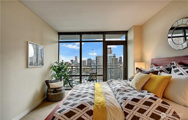 819 Virginia St Unit 3006, Seattle, WA 98101 - bedroom featuring floor to ceiling windows, access to exterior, baseboards, a city view, and carpet flooring