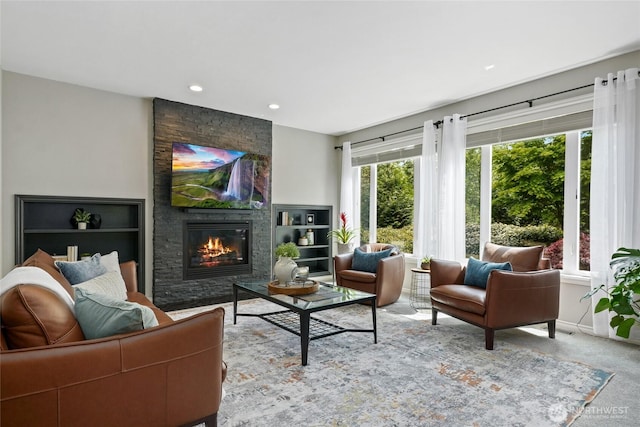 46707 SE 156th Pl, North Bend, WA 98045 - living room with a stone fireplace, recessed lighting, carpet floors, and baseboards