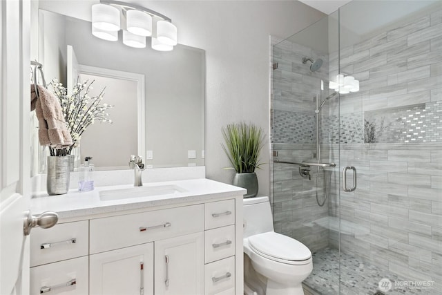 46707 SE 156th Pl, North Bend, WA 98045 - bathroom featuring a stall shower, vanity, and toilet