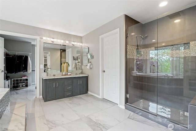 46707 SE 156th Pl, North Bend, WA 98045 - full bath with a stall shower, baseboards, double vanity, a walk in closet, and marble finish floors