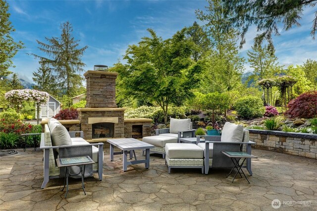 46707 SE 156th Pl, North Bend, WA 98045 - view of patio with an outdoor living space with a fireplace