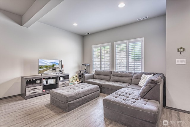 living room with recessed lighting, baseboards, visible vents, and wood finished floors