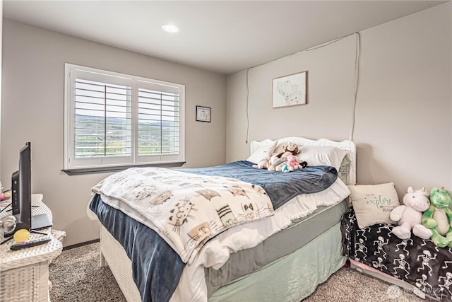 carpeted bedroom featuring recessed lighting