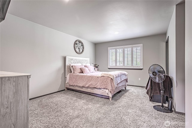 carpeted bedroom with baseboards