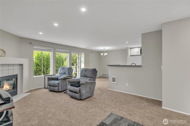 living room with baseboards and light colored carpet
