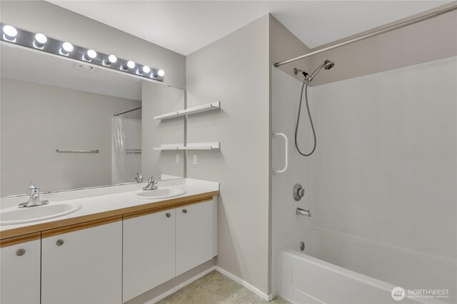 bathroom with a sink, baseboards, double vanity, and shower / tub combo with curtain