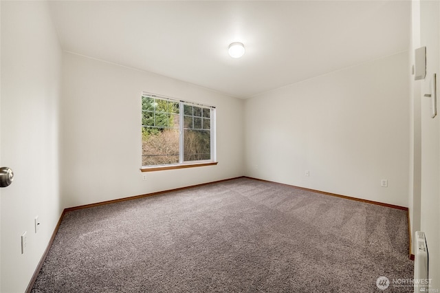 carpeted empty room with baseboards and baseboard heating