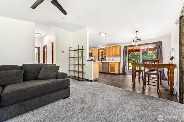 104 Ridge View Dr, Randle, WA 98377 - living area with dark colored carpet, a ceiling fan, recessed lighting, and a chandelier