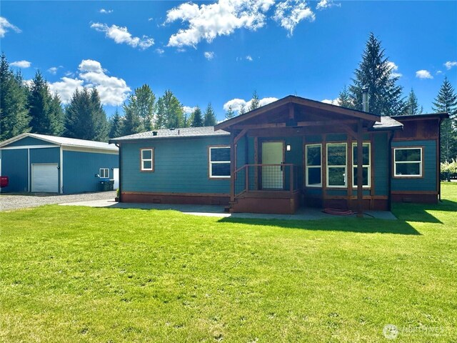 104 Ridge View Dr, Randle, WA 98377 - view of front of home featuring a garage, an outdoor structure, a front lawn, and crawl space