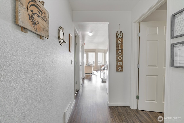 501 Shoreview Dr S Unit 204, Long Beach, WA 98631 - hallway featuring baseboards, dark wood-type flooring, and visible vents
