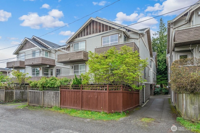 view of home's exterior featuring fence and board and batten siding