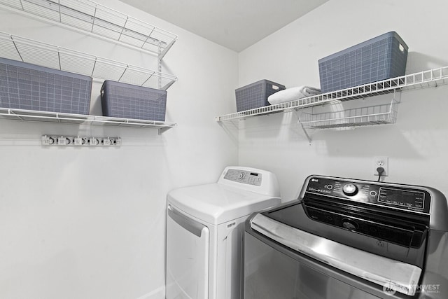 laundry area with laundry area and washing machine and dryer