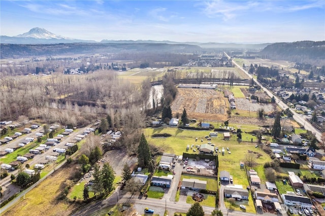 birds eye view of property with a mountain view