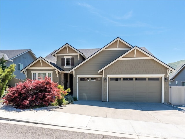 1974 Legendary Ln SE, East Wenatchee, WA 98802 - craftsman-style home with a garage, concrete driveway, roof with shingles, and fence