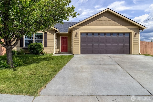 301 NE Danner Ln, College Place, WA 99324 - ranch-style home with fence, an attached garage, concrete driveway, and a front yard