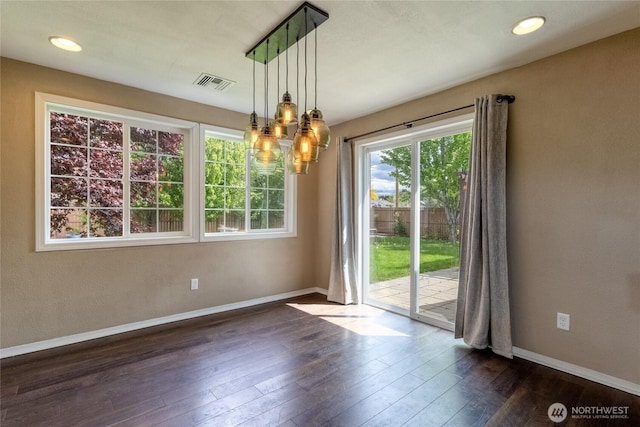 301 NE Danner Ln, College Place, WA 99324 - unfurnished dining area with visible vents, recessed lighting, baseboards, and dark wood-style floors