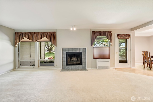 2506 SE Baypoint Dr Unit L45, Vancouver, WA 98683 - unfurnished living room with carpet floors and a tile fireplace