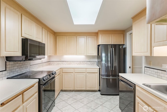 2506 SE Baypoint Dr Unit L45, Vancouver, WA 98683 - kitchen featuring light brown cabinetry, stainless steel appliances, decorative backsplash, and light countertops