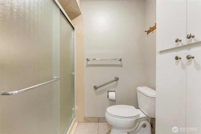 2506 SE Baypoint Dr Unit L45, Vancouver, WA 98683 - bathroom with toilet, tile patterned flooring, and a stall shower