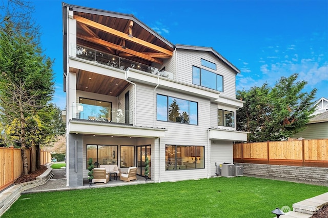 422 98th Ave NE, Bellevue, WA 98004 - back of house featuring outdoor lounge area, a fenced backyard, cooling unit, a balcony, and a yard