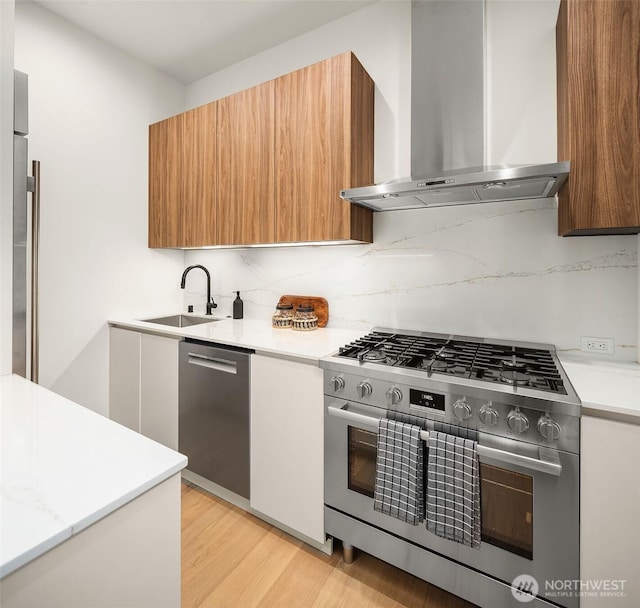 422 98th Ave NE, Bellevue, WA 98004 - kitchen with appliances with stainless steel finishes, a sink, light countertops, wall chimney exhaust hood, and modern cabinets