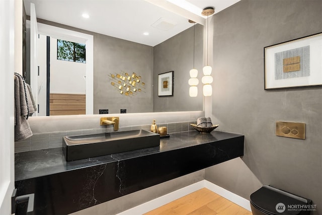 422 98th Ave NE, Bellevue, WA 98004 - bathroom featuring vanity, baseboards, and wood finished floors