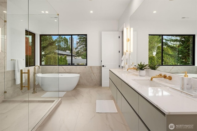 422 98th Ave NE, Bellevue, WA 98004 - bathroom featuring a sink, a soaking tub, marble finish floor, and a wealth of natural light