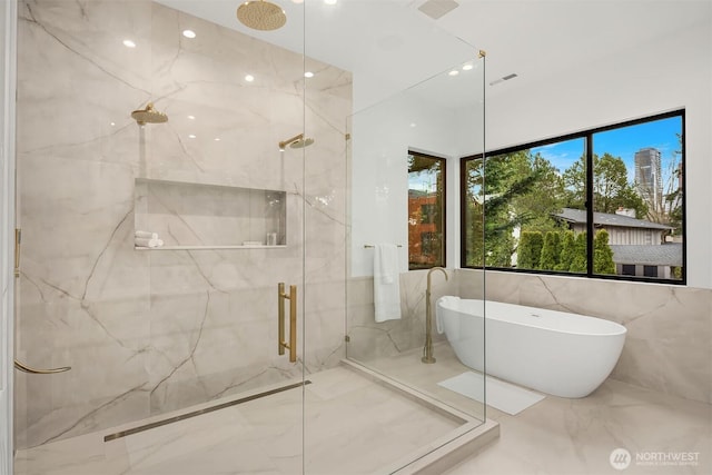 422 98th Ave NE, Bellevue, WA 98004 - full bathroom with marble finish floor, a freestanding bath, a marble finish shower, and tile walls