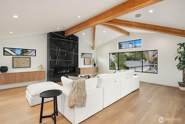 422 98th Ave NE, Bellevue, WA 98004 - living area featuring vaulted ceiling with beams, a large fireplace, recessed lighting, and light wood-type flooring