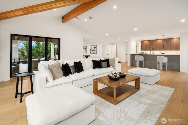 422 98th Ave NE, Bellevue, WA 98004 - living room featuring light wood-type flooring, recessed lighting, beam ceiling, and visible vents