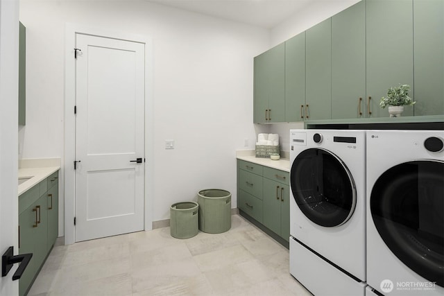 422 98th Ave NE, Bellevue, WA 98004 - laundry area featuring cabinet space, baseboards, and washing machine and dryer