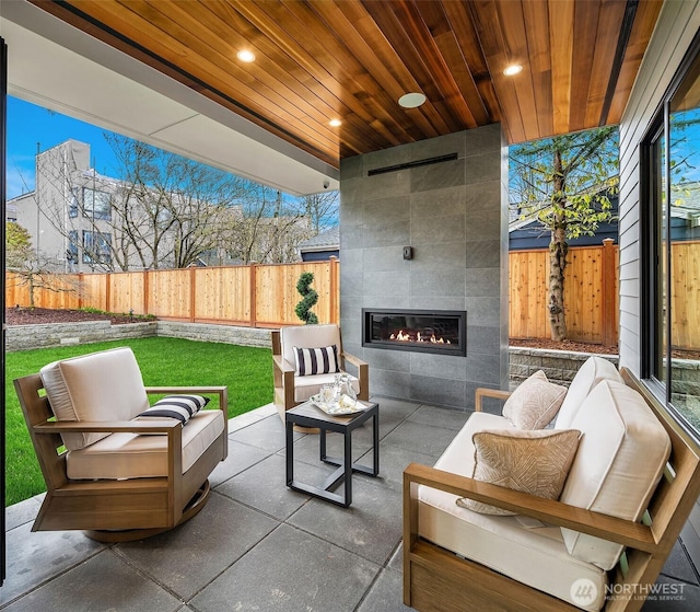 422 98th Ave NE, Bellevue, WA 98004 - view of patio / terrace featuring a fenced backyard and an outdoor living space with a fireplace