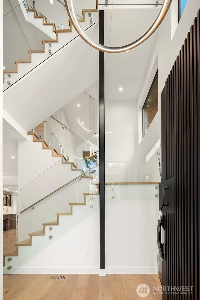 422 98th Ave NE, Bellevue, WA 98004 - staircase featuring wood finished floors