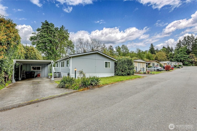 8760 State Highway 303 NE Unit C, Bremerton, WA 98311 - view of front of house with driveway and an attached carport