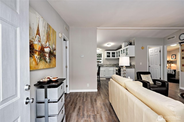 8760 State Highway 303 NE Unit C, Bremerton, WA 98311 - living room featuring baseboards, dark wood-style flooring, and visible vents