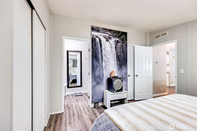 8760 State Highway 303 NE Unit C, Bremerton, WA 98311 - bedroom with visible vents and wood finished floors