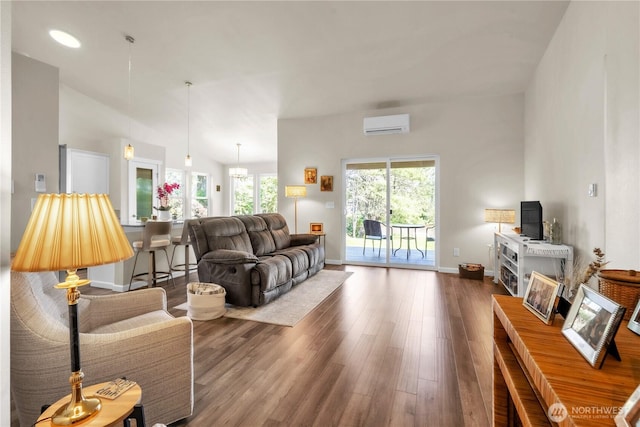 464 Dolphin Ave NE, Ocean Shores, WA 98569 - living area with baseboards, a wall unit AC, and dark wood-style floors