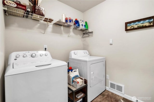 464 Dolphin Ave NE, Ocean Shores, WA 98569 - washroom featuring separate washer and dryer, laundry area, visible vents, and baseboards