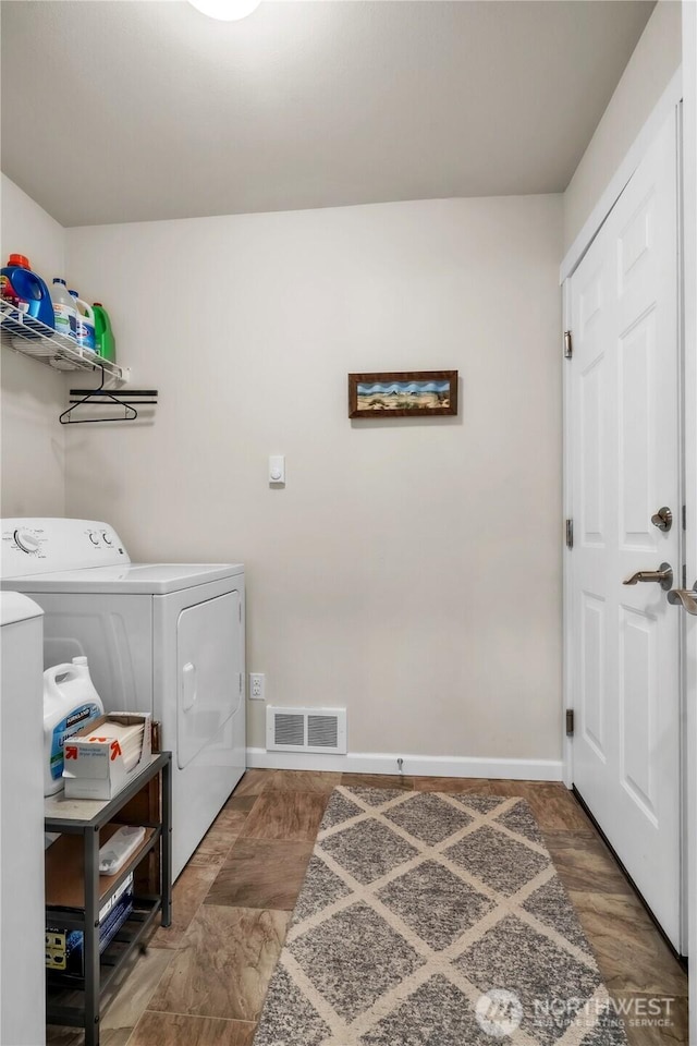464 Dolphin Ave NE, Ocean Shores, WA 98569 - laundry room with visible vents, laundry area, baseboards, and separate washer and dryer