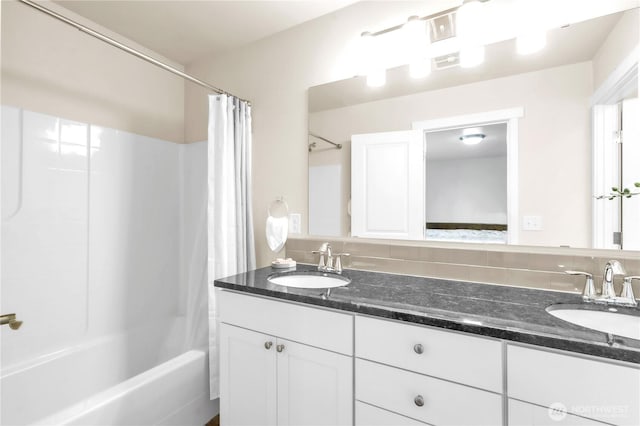 464 Dolphin Ave NE, Ocean Shores, WA 98569 - full bath featuring double vanity, tasteful backsplash, a sink, and shower / tub combo with curtain