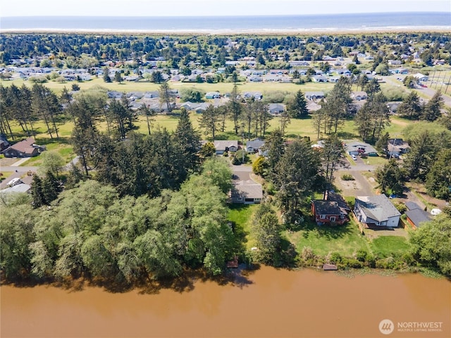 464 Dolphin Ave NE, Ocean Shores, WA 98569 - drone / aerial view with a water view and a residential view