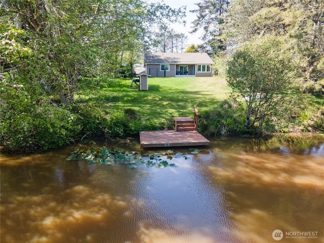 464 Dolphin Ave NE, Ocean Shores, WA 98569 - view of dock with a lawn and a water view