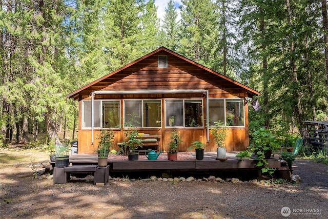 43 Arnica Ln, Twisp, WA 98856 - view of front of house featuring a sunroom and a deck