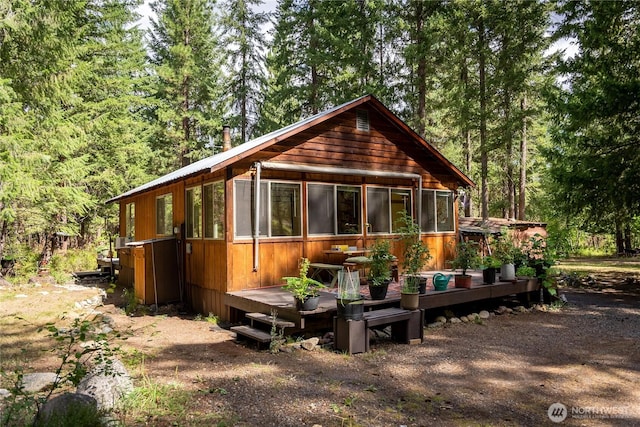 43 Arnica Ln, Twisp, WA 98856 - rear view of property featuring a deck and a sunroom