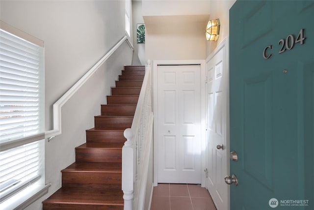 staircase with tile patterned floors