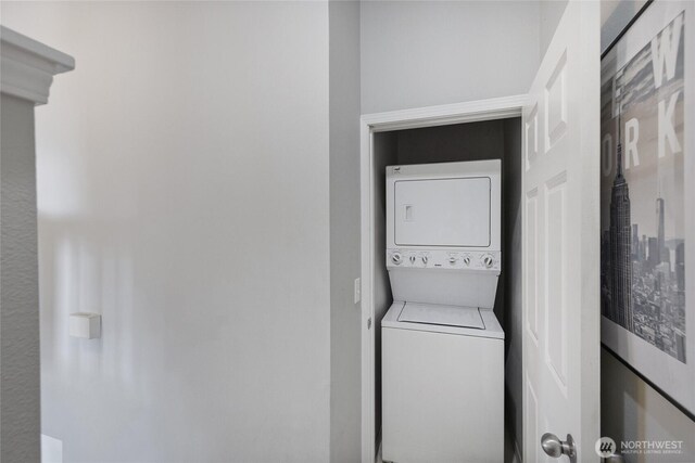 laundry room featuring laundry area and stacked washer and dryer