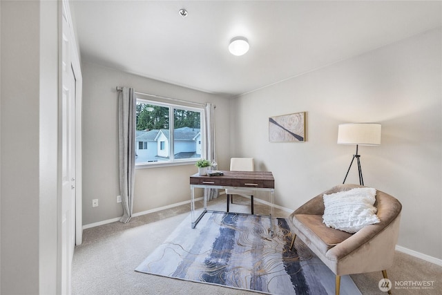 carpeted office with baseboards