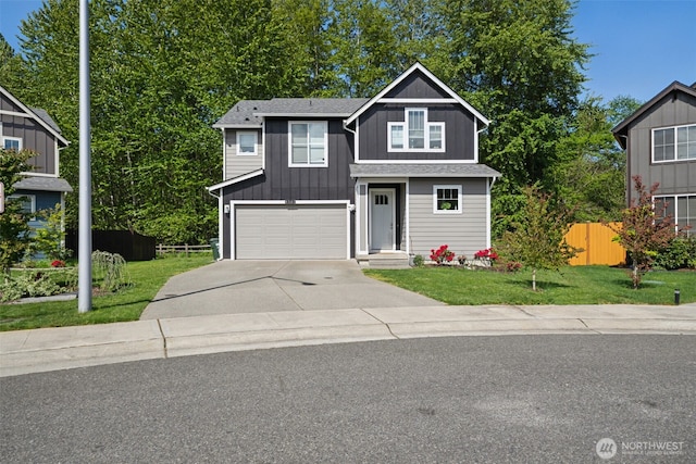 8501 143rd St E, Puyallup, WA 98373 - view of front of home featuring board and batten siding, fence, driveway, and a front yard